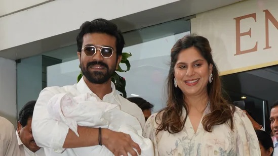 Ram Charan and Upasana Konidela showered with rose petals as they posed with their newborn for the first time