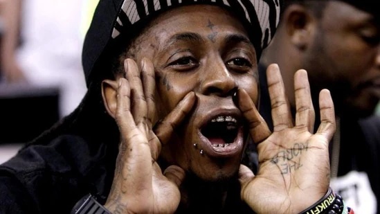Lil Wayne reacts to his Hollywood Wax Museum figure, saying, “Sorry, that ain’t me!”